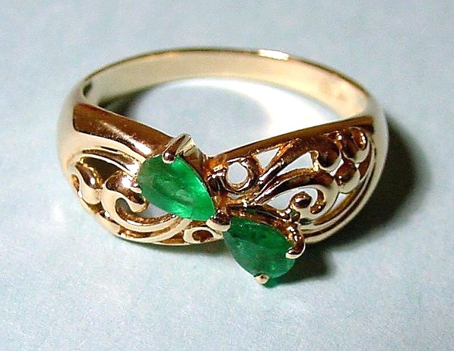 beryl-green-faceted emeralds in ring