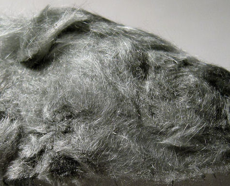 byssolite-gray hair-like crystals