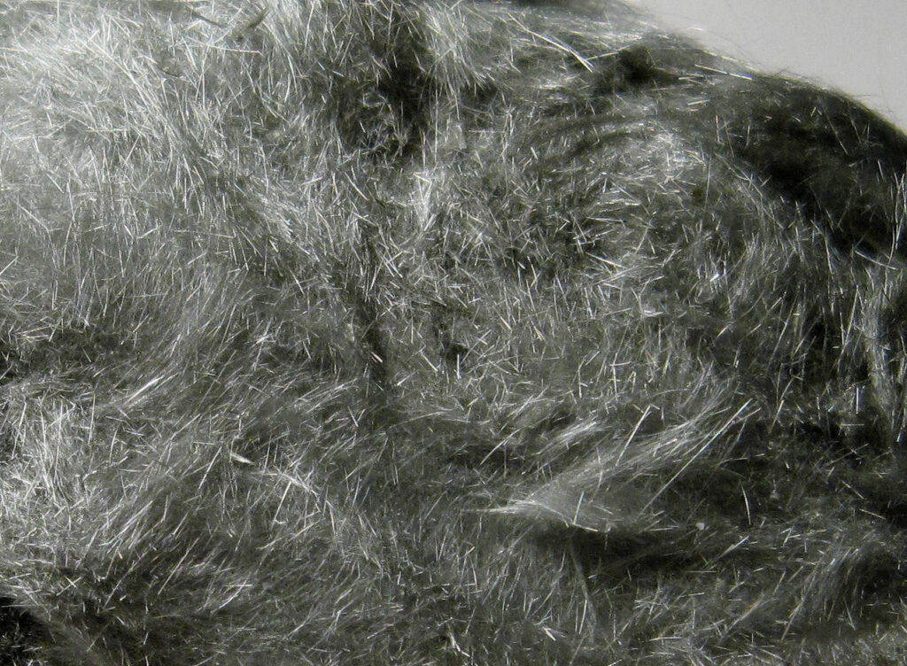 byssolite-gray hair-like crystals