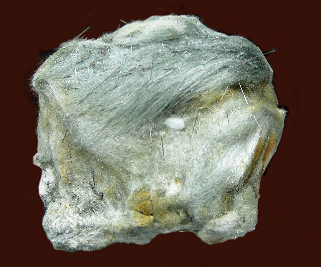 byssolite-gray hair-like crystals