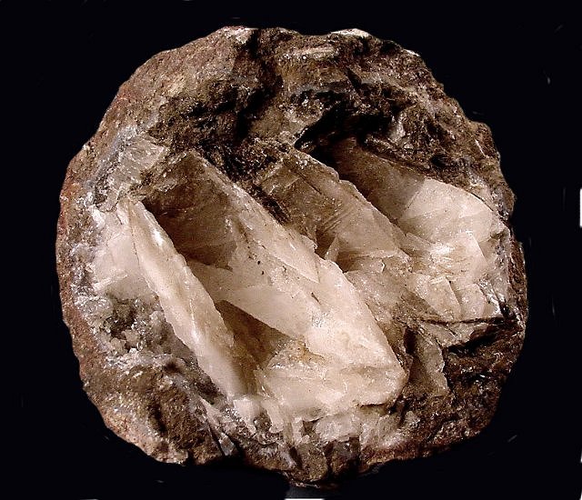 calcite-thin white crystal blades inside hollow thunderegg