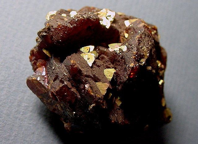 chalcopyrite-yellow metallic luster crystals on brown sphalerite