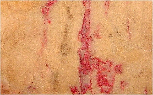 cinnabar-red patches in yellow common opal