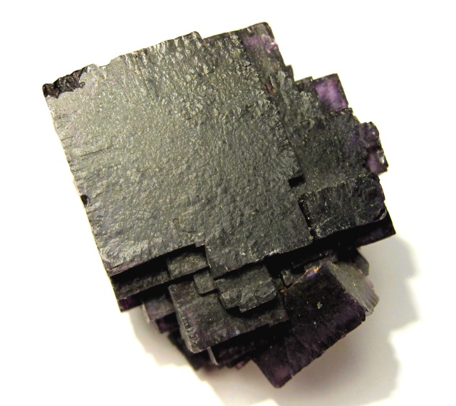 fluorite-cubic crystals-dark purple with brown surface