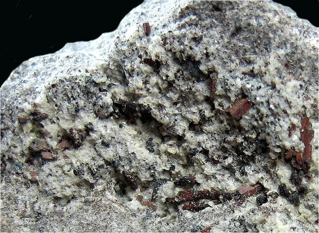 hypersthene-poorly crystallized gray mass