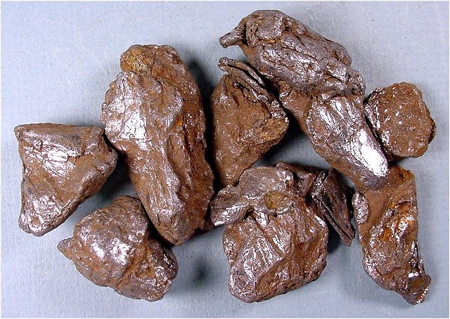 molybdenite-silvery fragments covered by brown dust-15