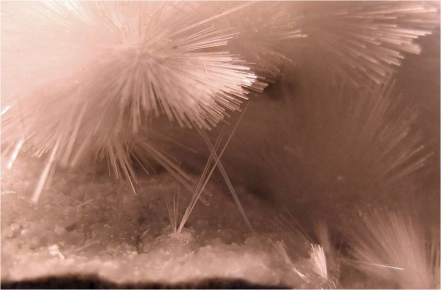 okenite-light pink radiating cluster of hair-thin crystals