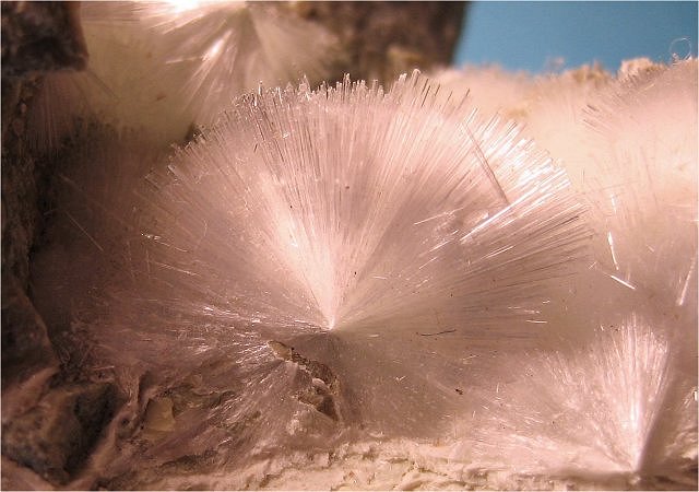 okenite-light pink radiating cluster of hair-thin crystals