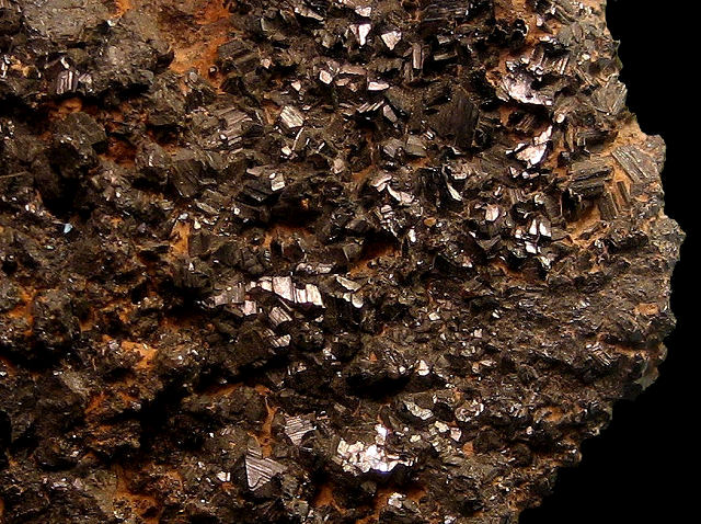 rutile-surface covered by small black crystals