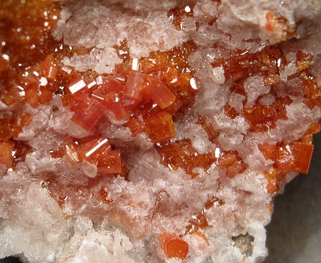 vanadinite orange red crystal clusters on white calcite
