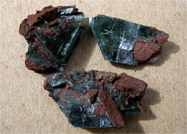 vivianite almost black crystals on red iron oxide Mexico