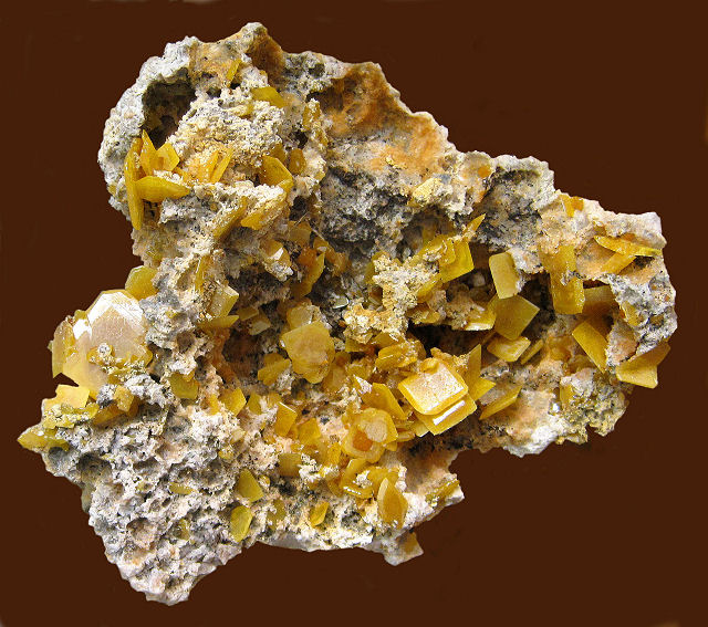 wulfenite cluster of light yellow thin square crystals