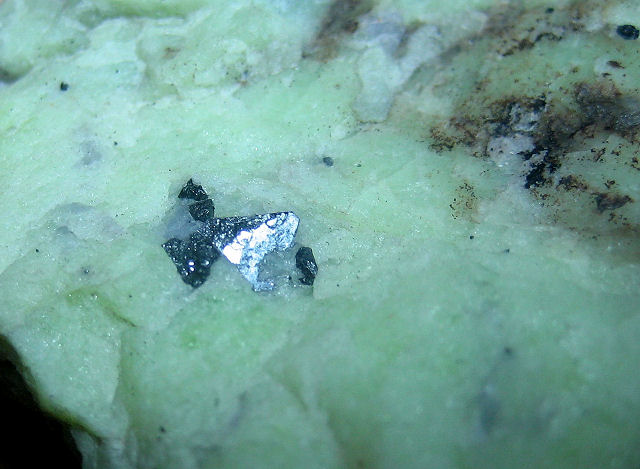 wurtzite 2 silver white tetrahedron crystals on pale green matrix