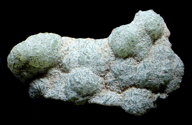 laumontite-white coating on green prehnite