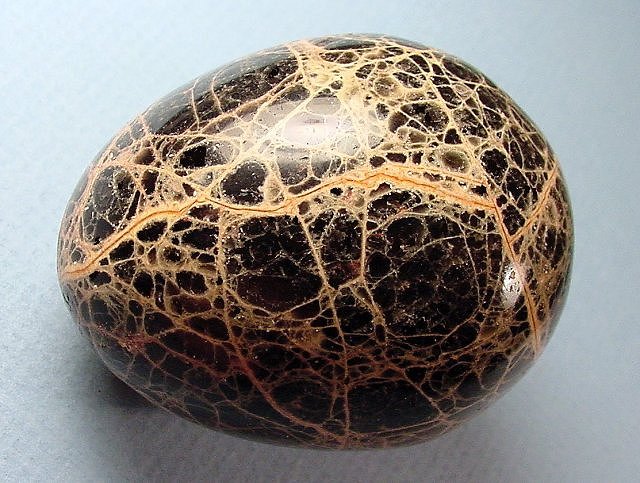 obsidian egg black crackled texture polished